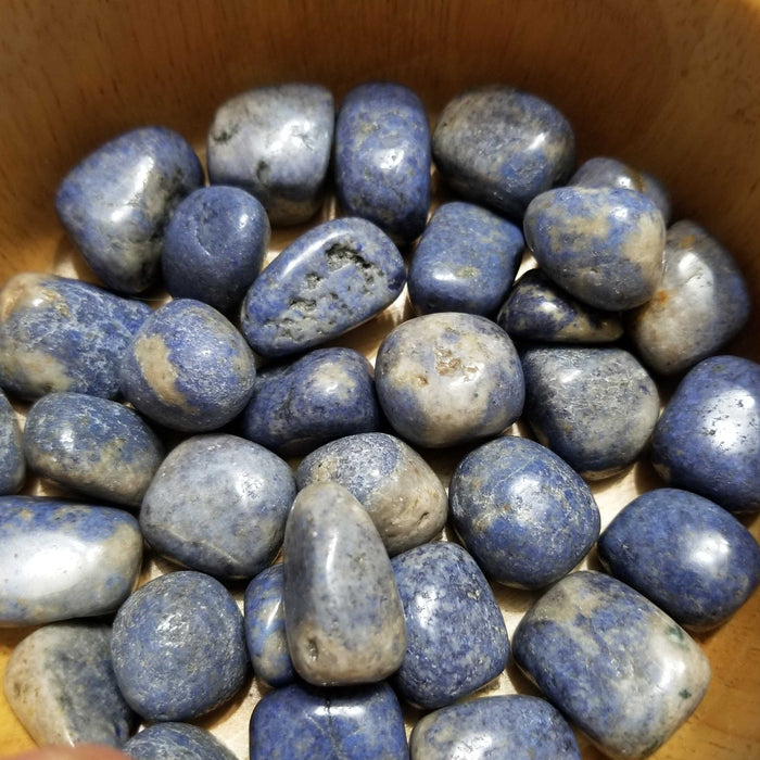 Natural Blue Dumortierite Quartz stones showcasing beautiful blue hues, perfect for promoting patience and self-assertiveness.