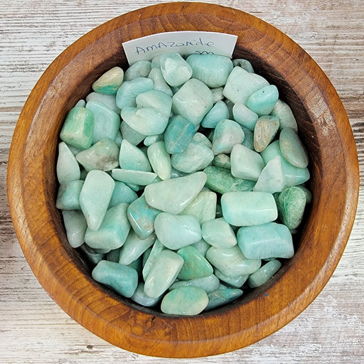 A stunning piece of Amazonite Tumbled, showcasing its serene turquoise hues and smooth, polished surface, known as 'The Stone of Harmony and Healing'.