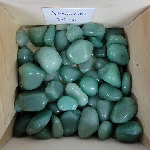 Aventurine Tumbled Stone showcasing its vibrant green color, known as the stone of opportunity, perfect for manifesting prosperity and wealth.