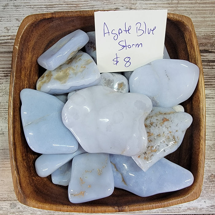 Beautiful Blue Storm Agate showcasing deep blue tones with banding, known for promoting inner peace and focus.