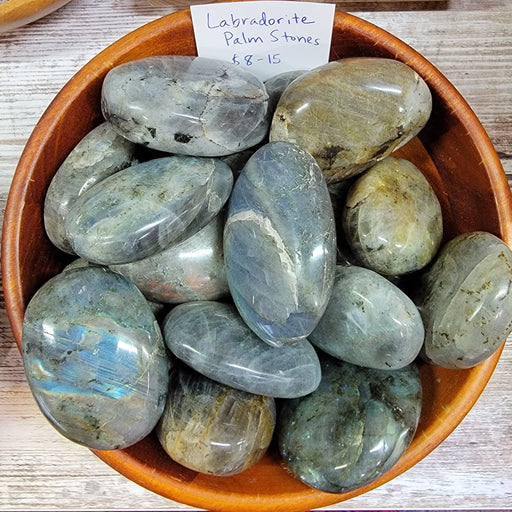 Beautiful Labradorite Palm Stone, hand polished from Madagascar, showcasing its unique grey to black color with colorful iridescence, perfect for meditation and healing.