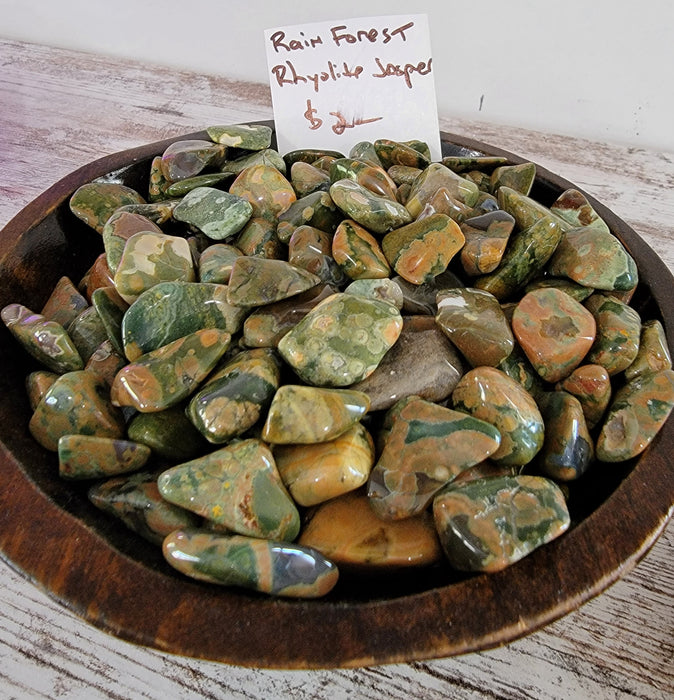 Stunning Rain Forest Rhyolite Jasper tumbled stones showcasing unique color patterns, ideal for crystal healing and decorative uses.