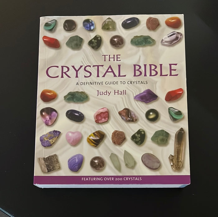 Cover of The Crystal Bible - Judy Hall featuring stunning crystal imagery and the book’s title prominently displayed. A definitive guide to crystals.