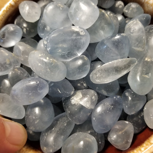 Beautiful Celestite tumbled stone in stunning blue hues, showcasing its natural crystal formation, perfect for collectors and crystal enthusiasts.