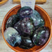Beautiful Rainbow Fluorite AA quality Palm stones, showcasing vibrant colors of pink, green, purple, and blue, perfect for grounding and harmonizing spiritual energy.